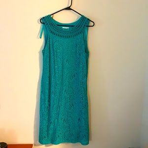 Teal mid length dress.